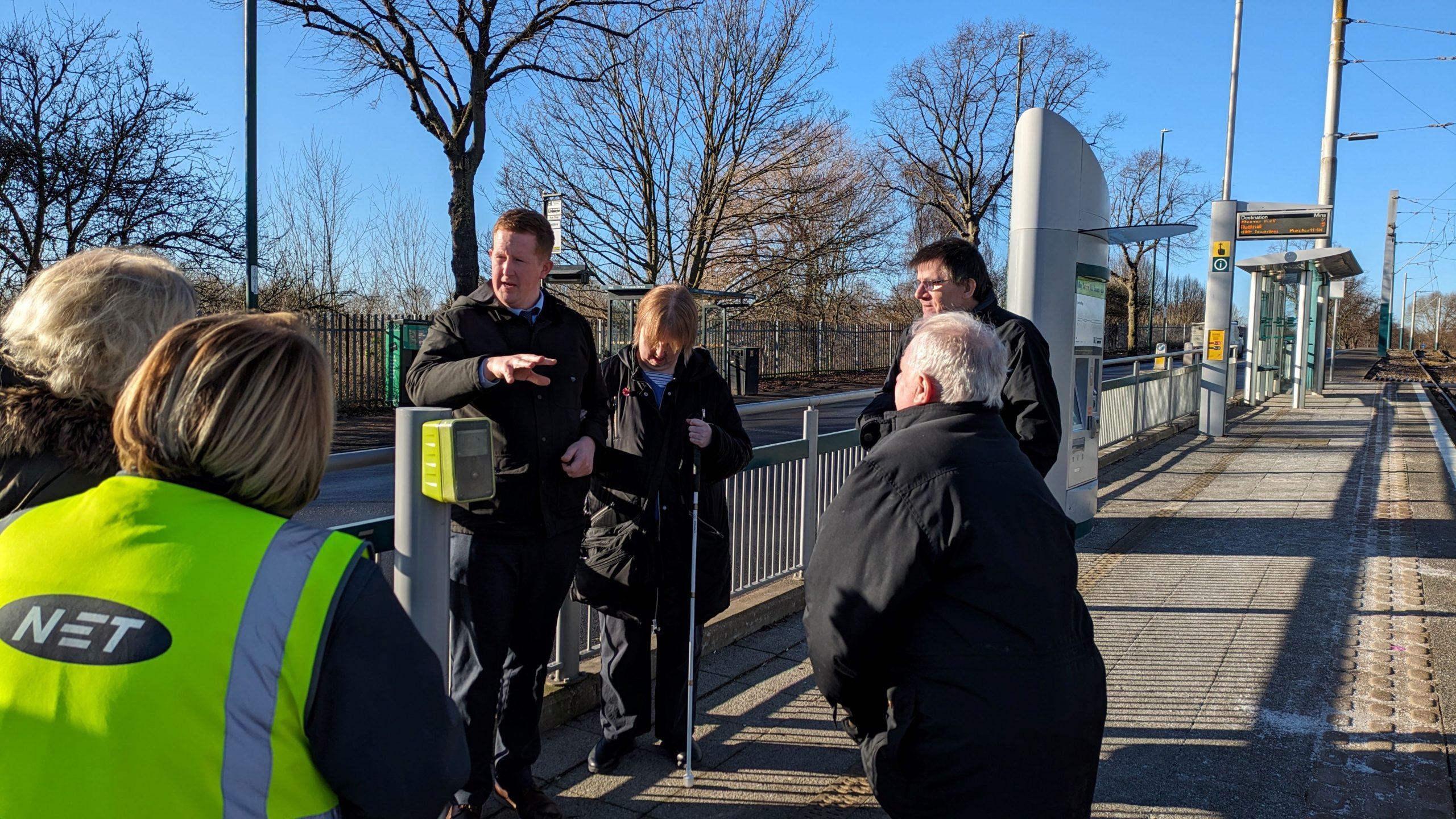 NET representative, talking to Nottinghamshire SLC members on a platform.