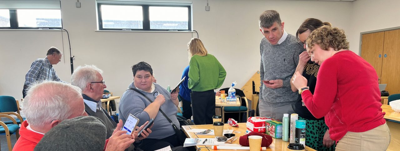 Delegates at the accessibility event, using their smart phones on a range of products to trial the NaviLens app.