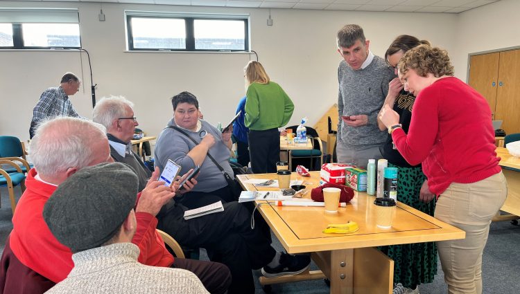 Delegates at the accessibility event, using their smart phones on a range of products to trial the NaviLens app.