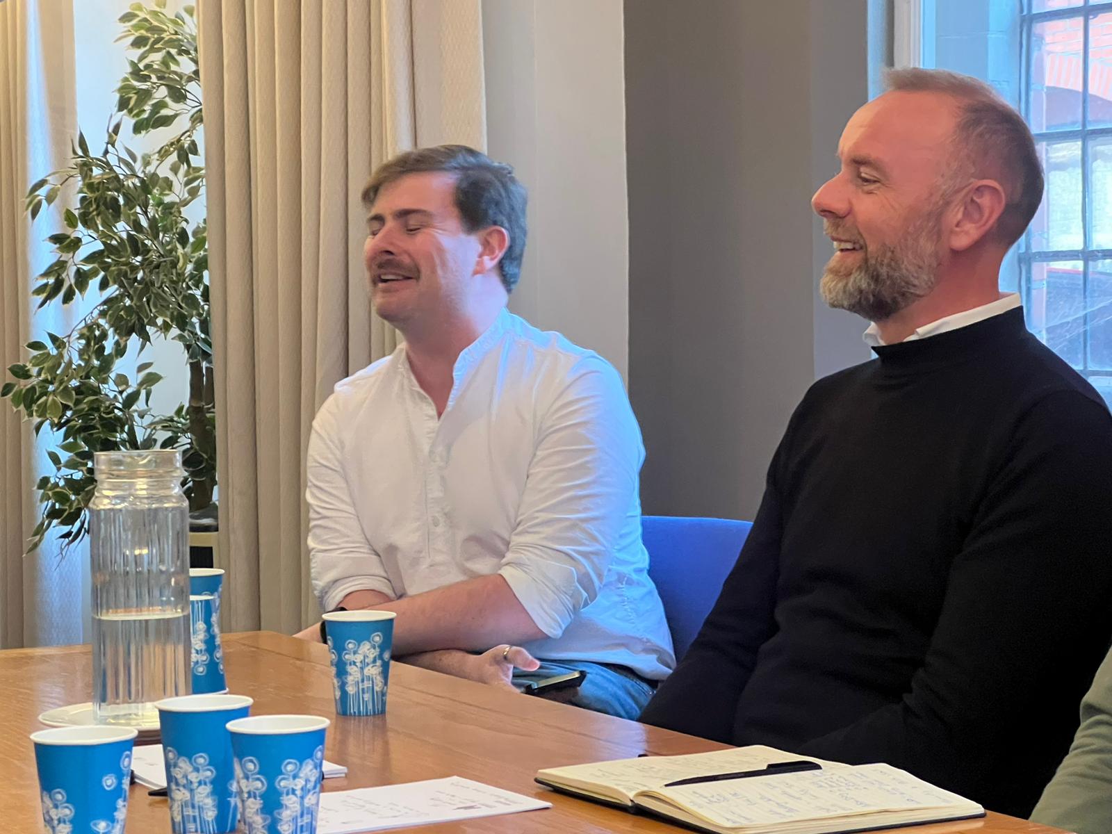 Paul Gallagher, Global Accessibility Leader at Proctor and Gamble and Oran McAlistair, Client Engagement Officer at NaviLens, pictured looking forwards, smiling. They are seated.