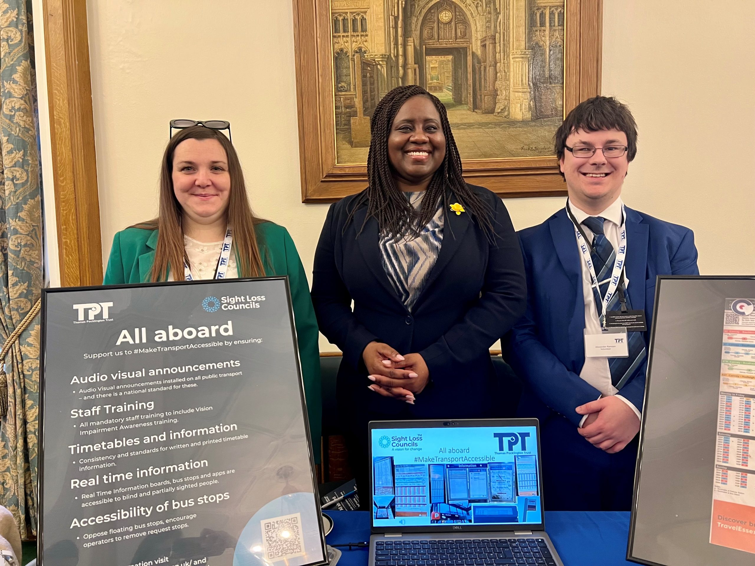 Samantha Leftwich, Engagement Manager for East England, Marsha De Cordova, MP, and Alex Ramzan, Essex SLC member. They are stood behind SLCs 'All aboard' poster outlining support required.