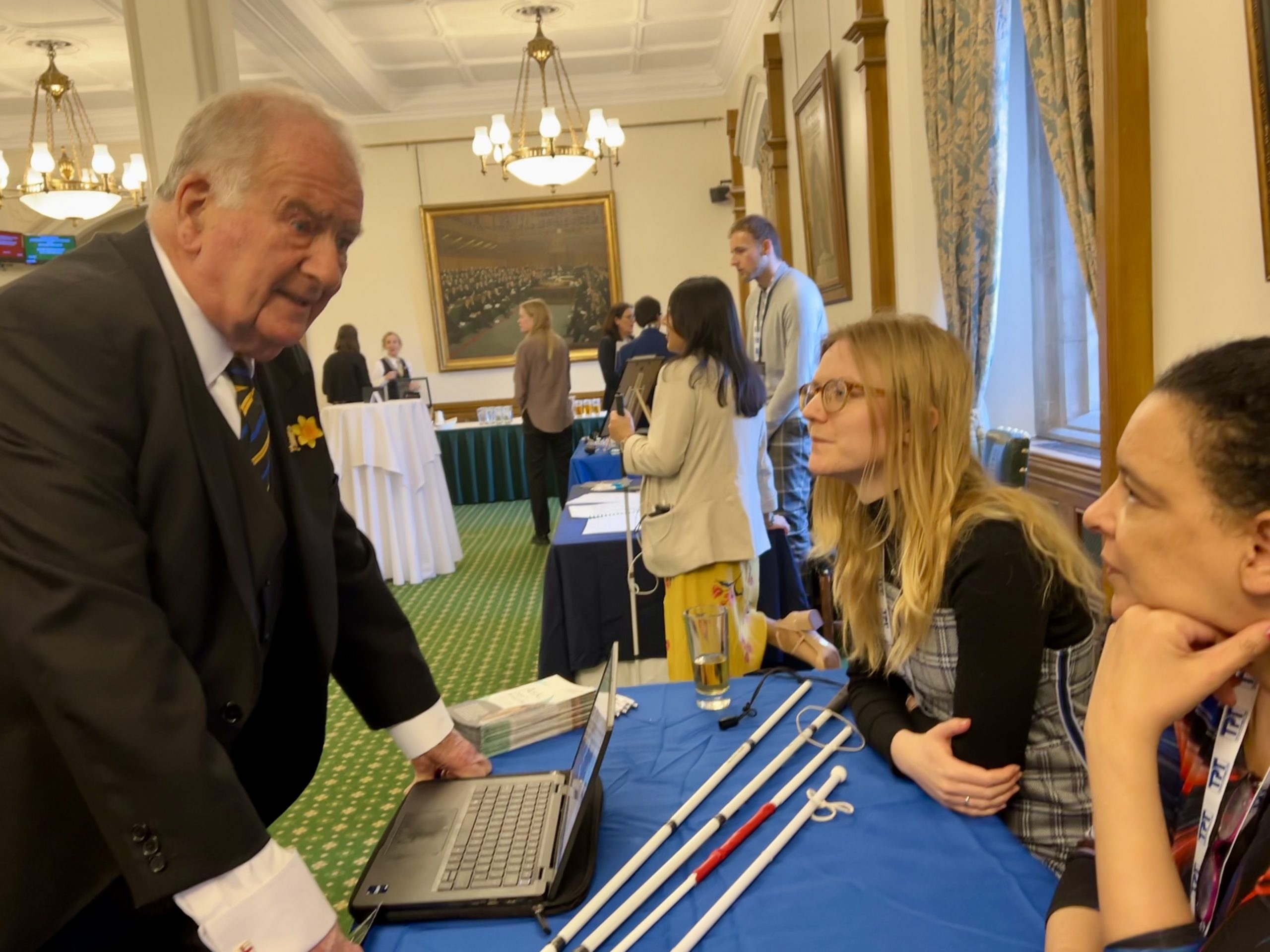 Sir Roger Gale, Deputy Speaker and MP, talking to Senior Engagement Manager Lucy WIlliams, and SLC volunteer Denise, at their built environment stand.