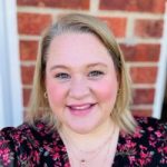 Headshot of Dannie Gage, Derbyshire SLC member. She is stood outside a house, smiling at the camera.