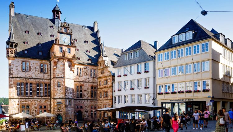 Cityscape of the German city of Marburg with historical townhall and market place. City with cafes and restaurants