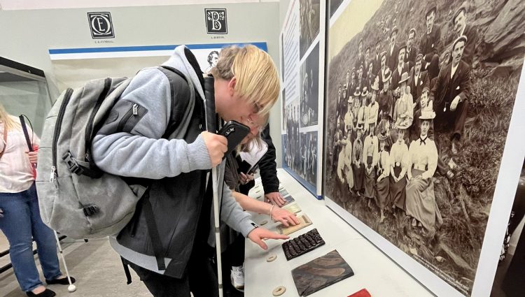 Greater Manchester Sight Loss Council member Anthony Cough pictured feeling tactile exhibitions at Orsdall Hall.