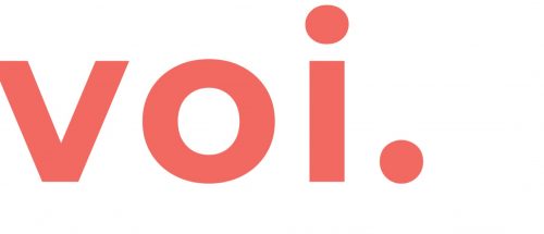 Voi logo. Voi is printed in large, bold orange text on an off white background.