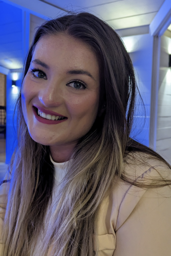 Headshot of Belle Whiteley, Sight Loss Councils Co-ordinator for Yorkshire and Humberside. Belle has long hair. She is looking at the camera and smiling.