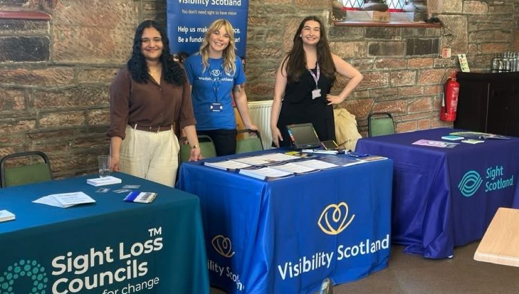 Picture standing Francesca Munoz, Steph Nicholson and Zara Grew stand behind their respective stalls of Sight Loss Councils, Visibility Scotland and Sight Scotland.